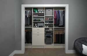 Walk-in closet with white dressers