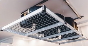 Overhead Storage rack with bins raised to the ceiling