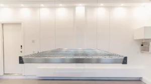 Empty Overhead storage rack lowered to waist height