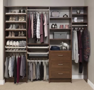 Beautiful custom closet organizer in a reach in closet Built into corner of room