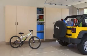 Maple Cabinets In a garage with an SUV and mountain bike
