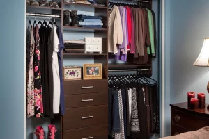 Beautiful custom closet organizer in a reach in closet built into a recess