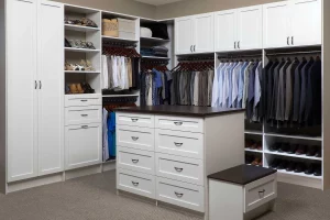 Large walk in closet with a custom closet organizer installed.