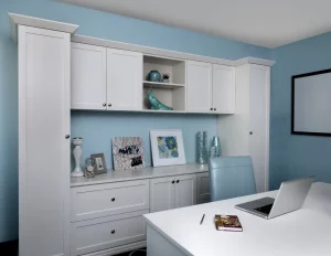 Home office with White Cabinets and shelves