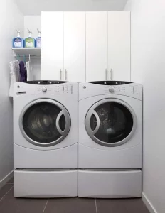 Custom laundry room cabinets help utilize the most of a small space