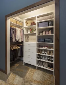 Beautiful custom closet organizer in a reach in closet with no doors.