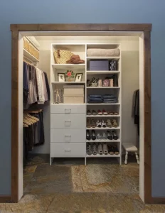 Custom closet organizer in a reach in closet.