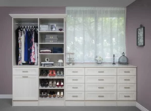 Walk in Closet with a chest of drawers Underneath a window