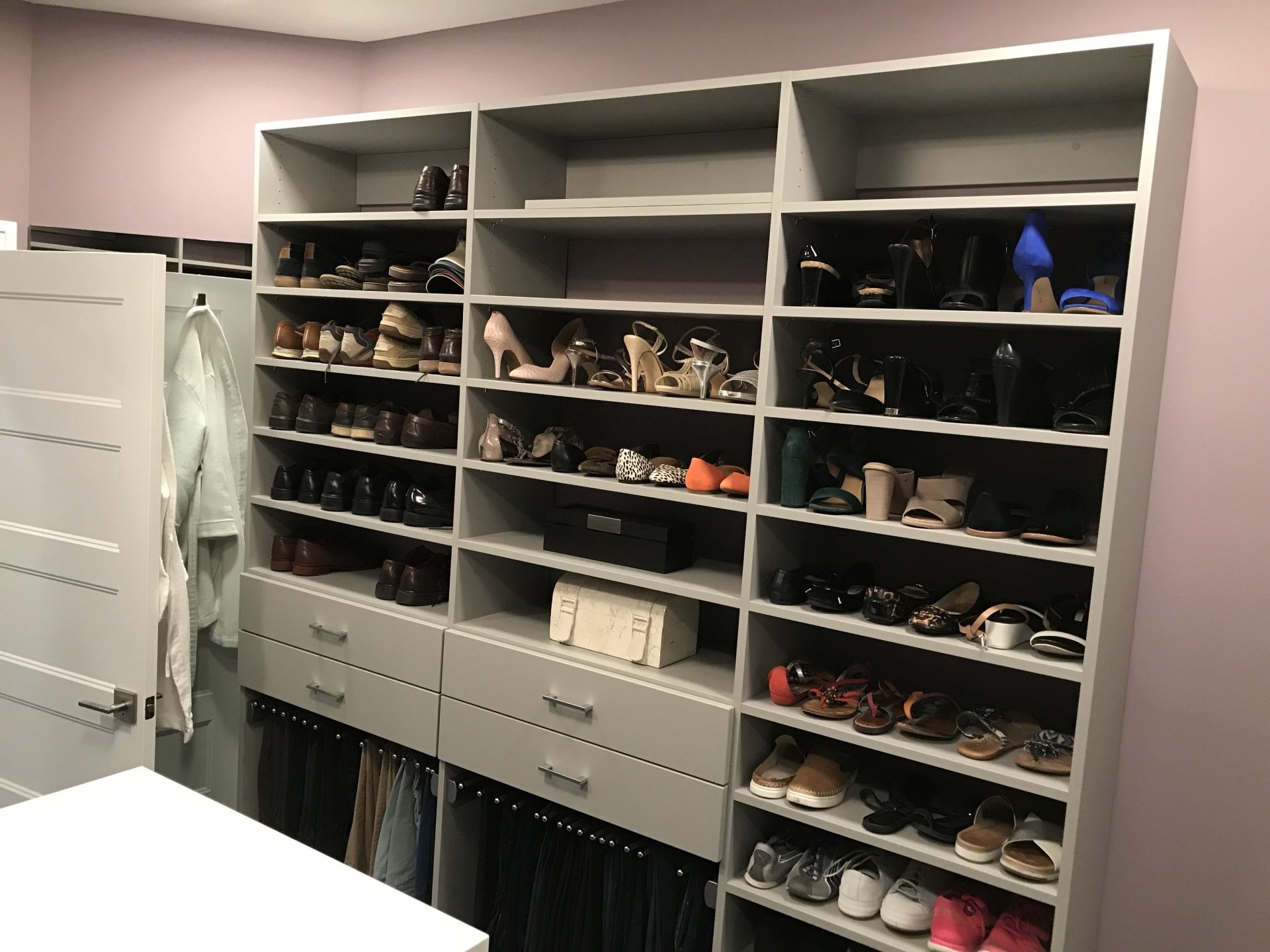 Custom closet solution with built in shelves and drawers. 