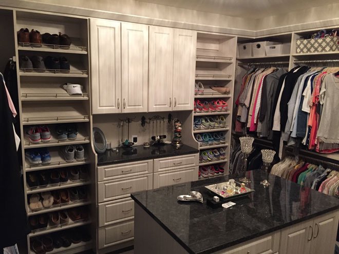 Custom closet solution with built in shelves and drawers. 