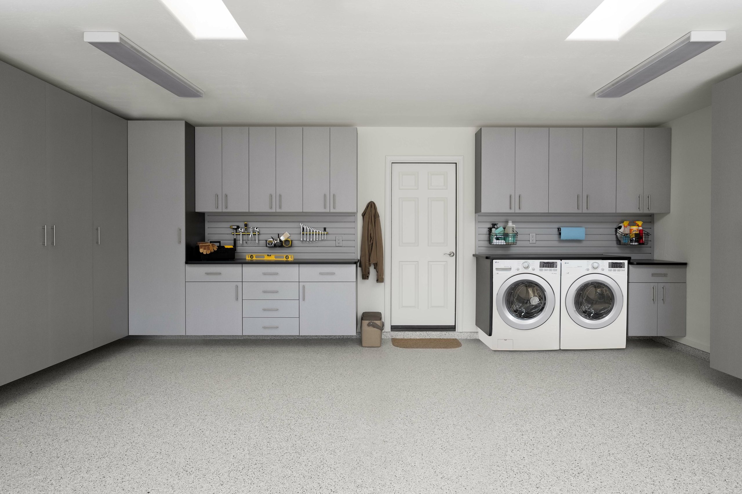 Organized garage with custom built in shelving. 