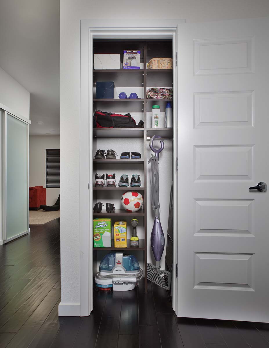Organized custom closet with built in shelving. 
