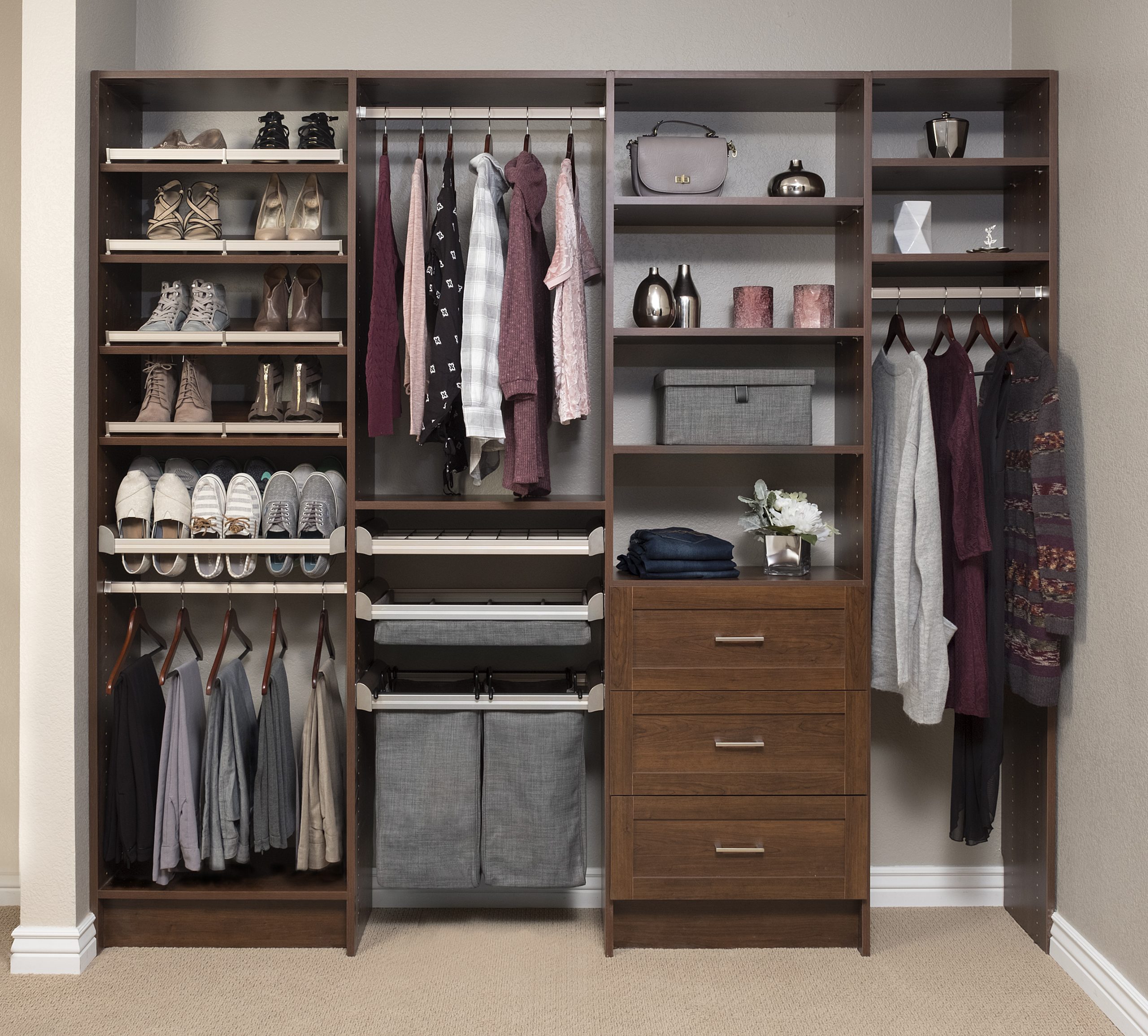 Open closet design that with dark wooden shelving and doors that was custom built. 